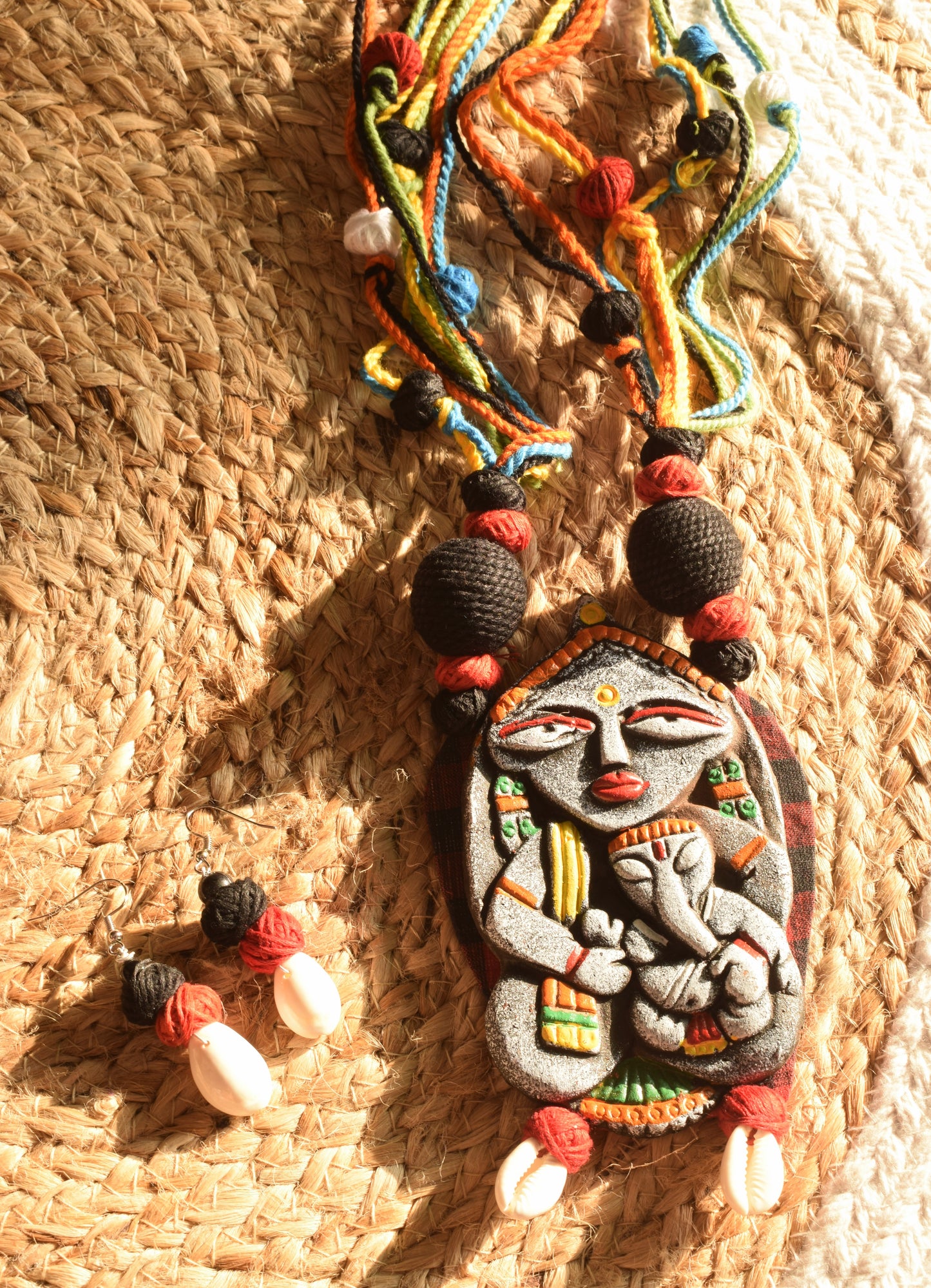 Terracotta Gauri Putra Ganesh Pendant Jute Necklace with Sea Shell Earrings