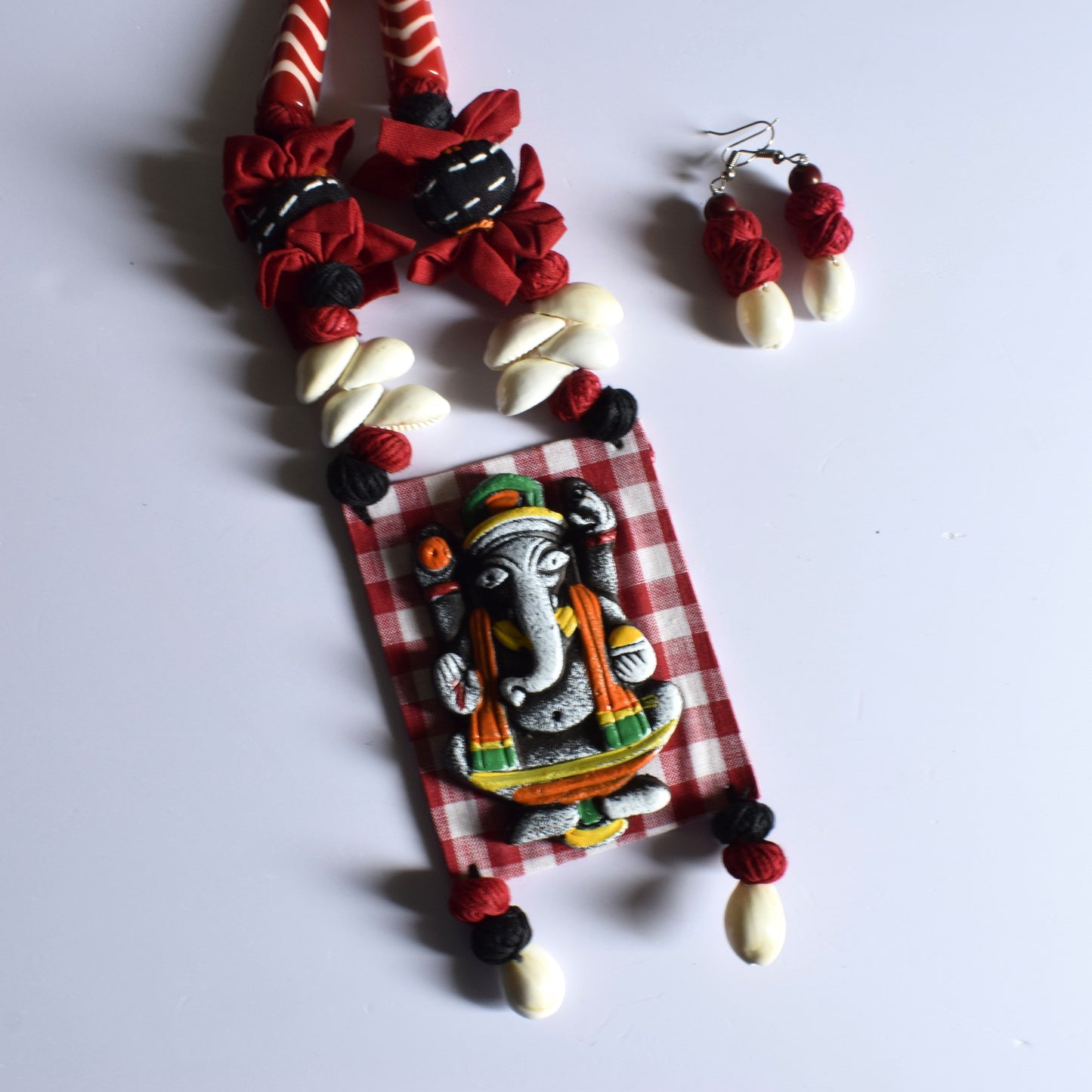 Terracotta Ganesh Pendant Fabric Necklace with Sea Shell Earrings