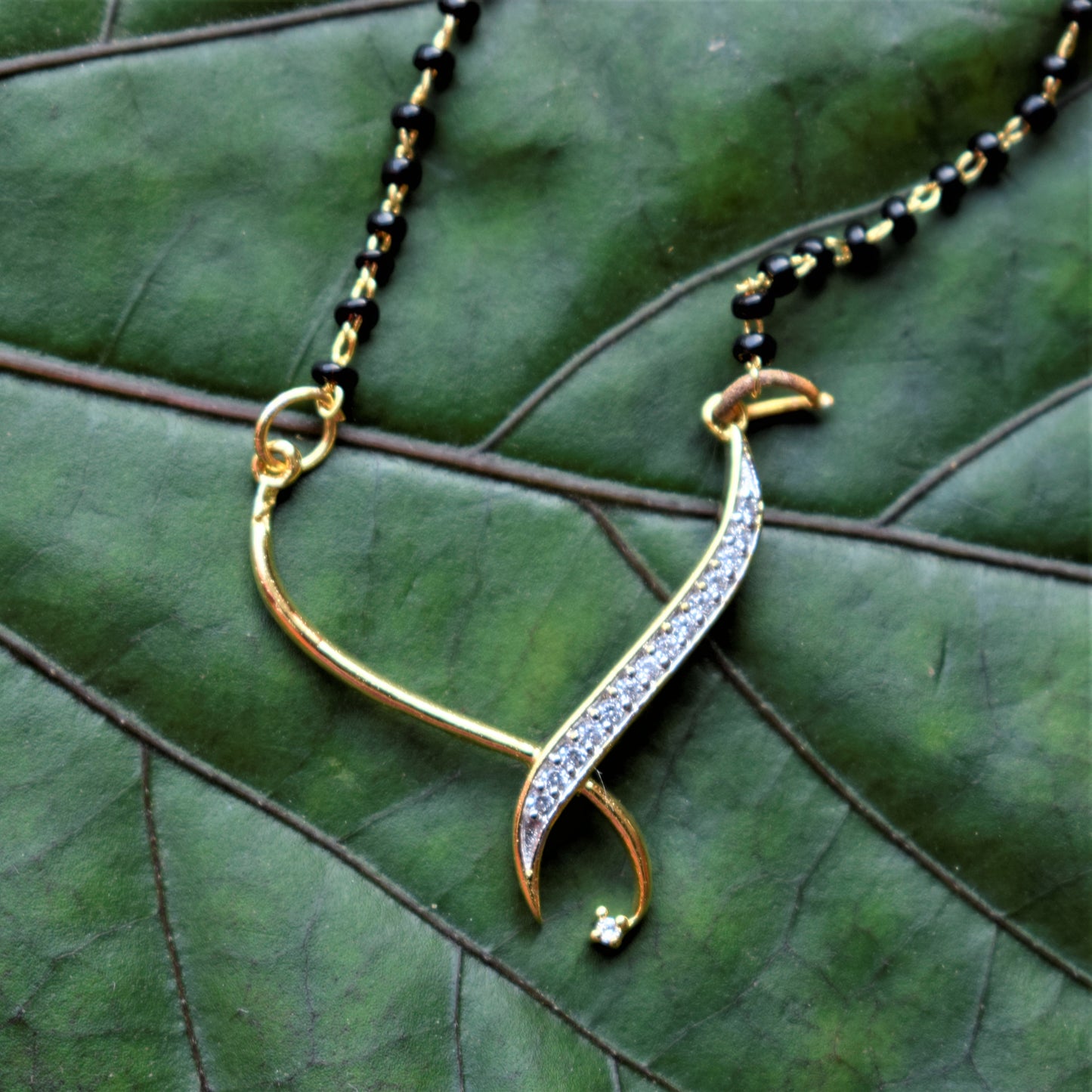Designer AD Pendant Mangalsutra with Earrings