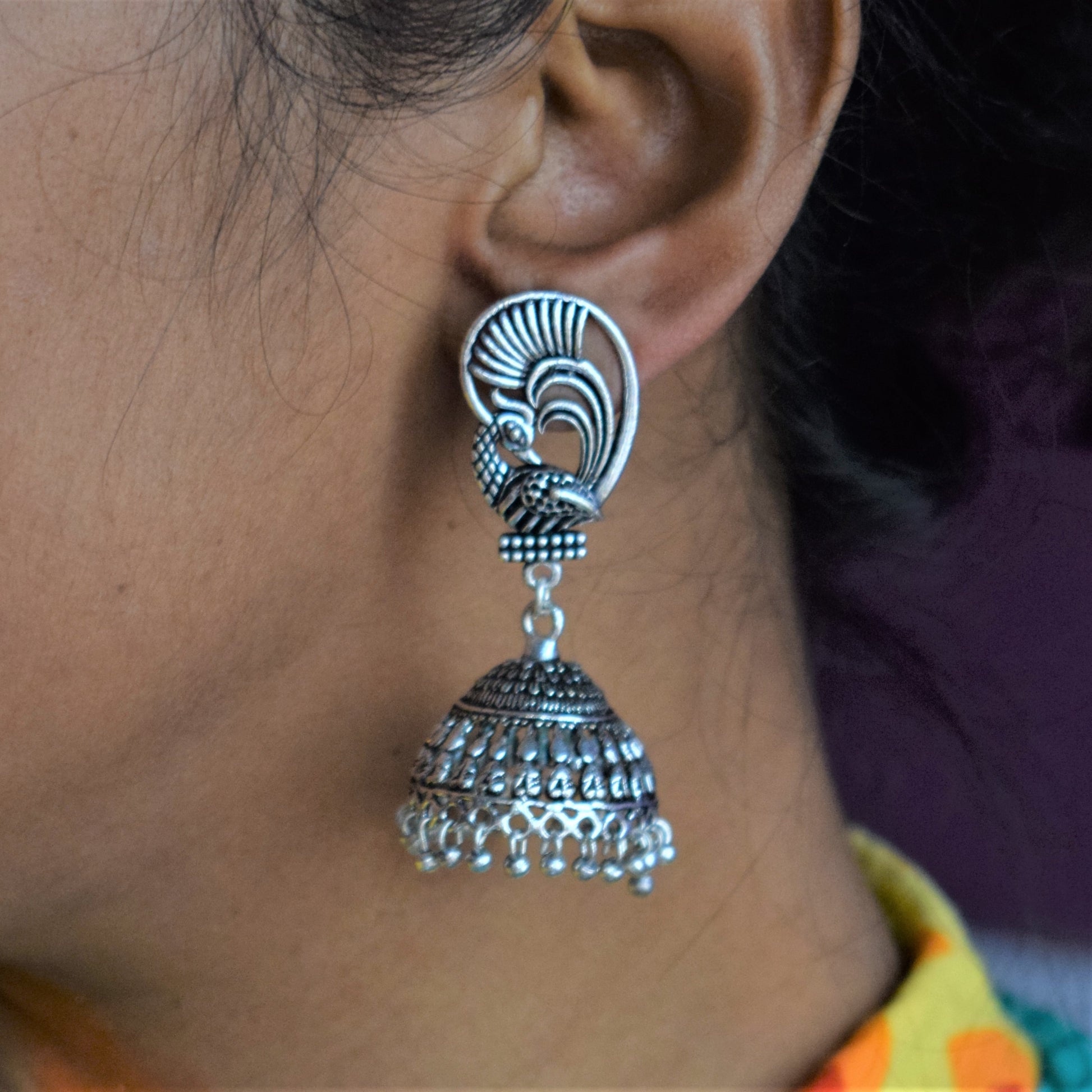 German Silver Peacock Winged Carved Jhumka - GlitterGleam