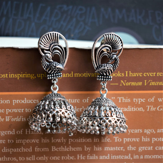 German Silver Peacock Winged Carved Jhumka - GlitterGleam