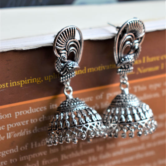 German Silver Peacock Winged Carved Jhumka - GlitterGleam