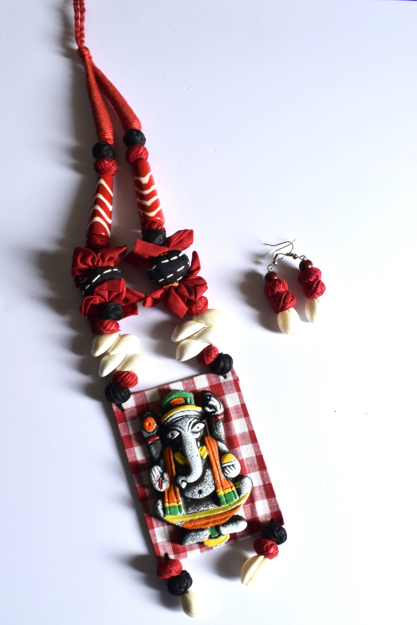 Terracotta Ganesh Pendant Fabric Necklace with Sea Shell Earrings