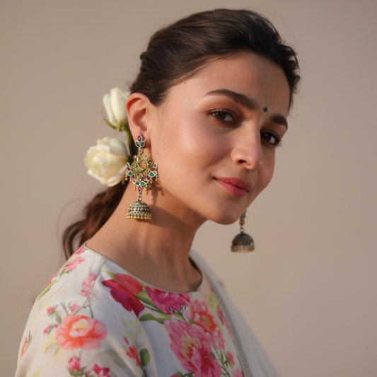Woman wearing floral earrings with a neutral background