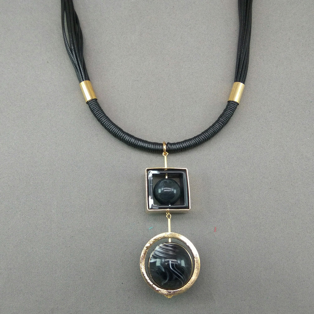 Rotating sphere leather string necklace - GlitterGleam