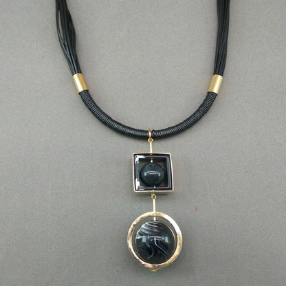 Rotating sphere leather string necklace - GlitterGleam