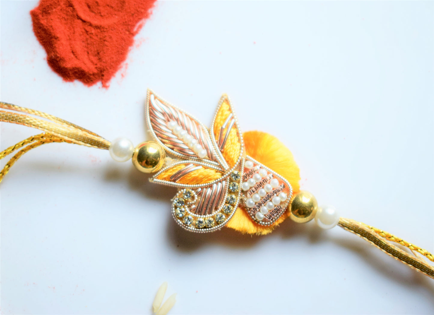 Zardozi and Pearl Peacock Traditional Rakhi (Yellow)