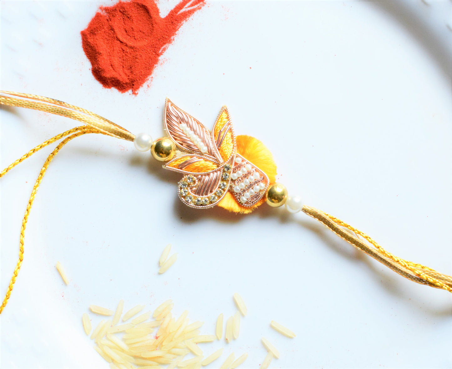 Zardozi and Pearl Peacock Traditional Rakhi (Yellow)