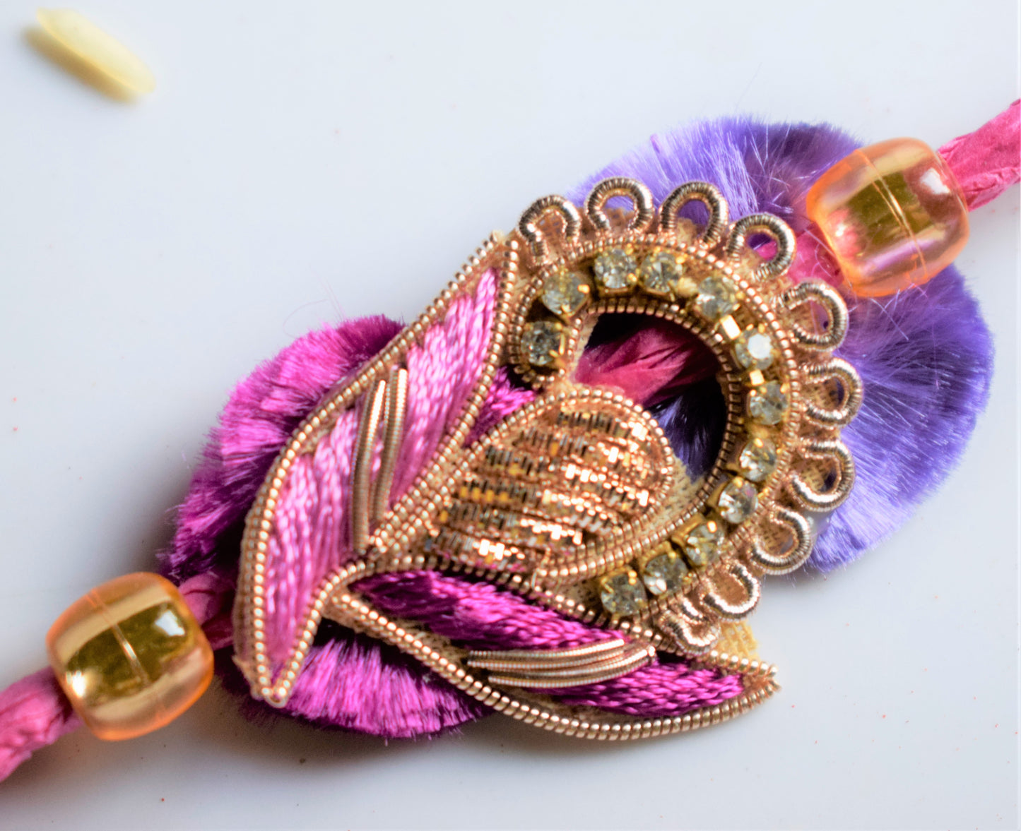 Traditional Zardozi Peacock Rakhi (Pink and Purple)