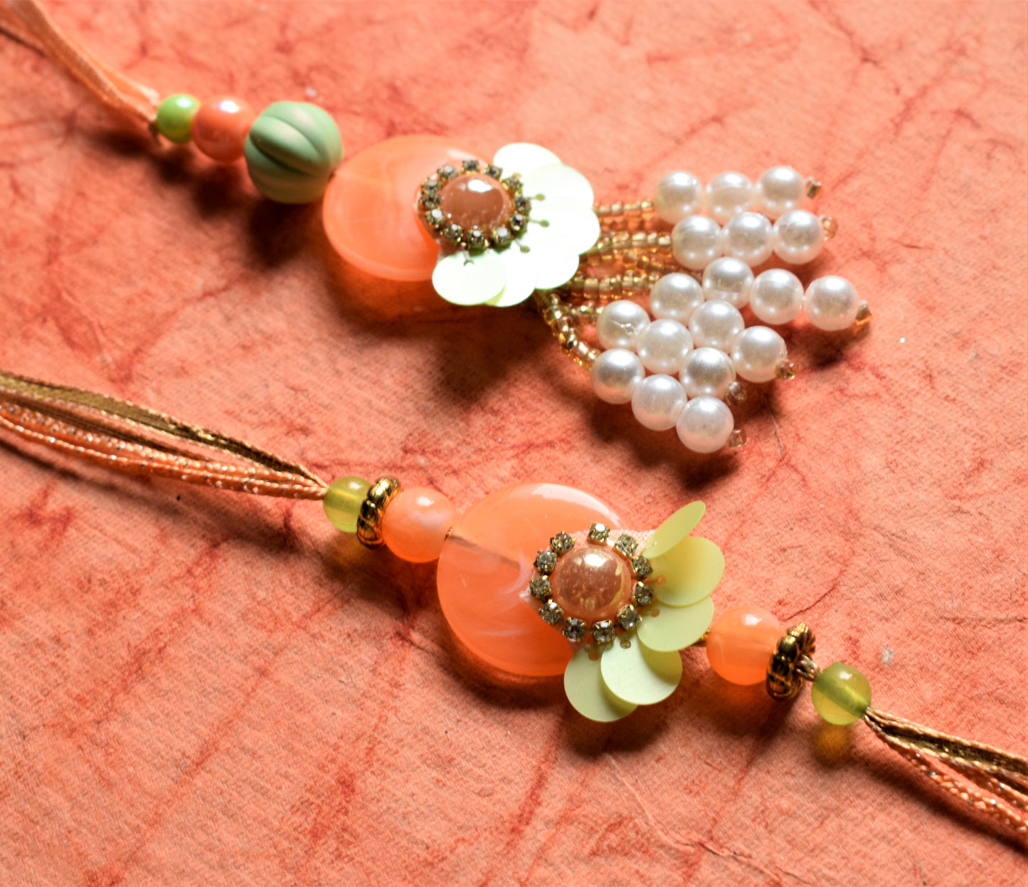 Pastel Freedom Sequin Rakhi Lumba Set (Orange and Green)