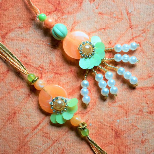 Pastel Freedom Sequin Rakhi Lumba Set (Orange and Green)