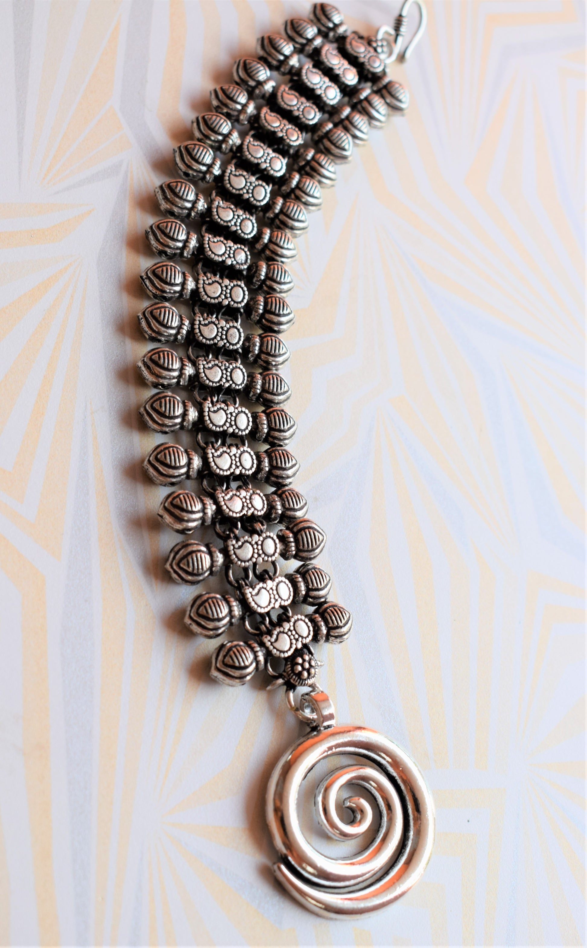 Designer German Silver Coil Pendant Bracelet - GlitterGleam