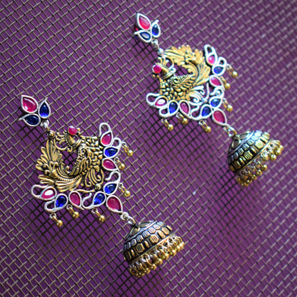 Dual Tone Peacock Gemstone German Silver Jhumki Earrings - GlitterGleam