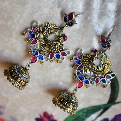 Dual Tone Peacock Gemstone German Silver Jhumki Earrings - GlitterGleam