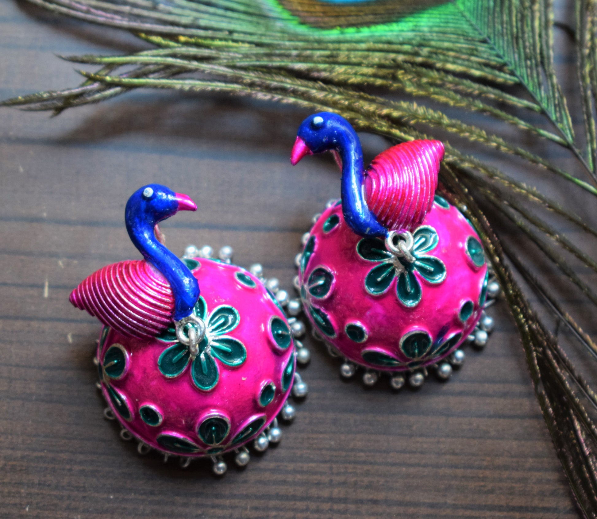 Pink and Blue Meenakari Peacock Carved German Silver Jhumki - GlitterGleam