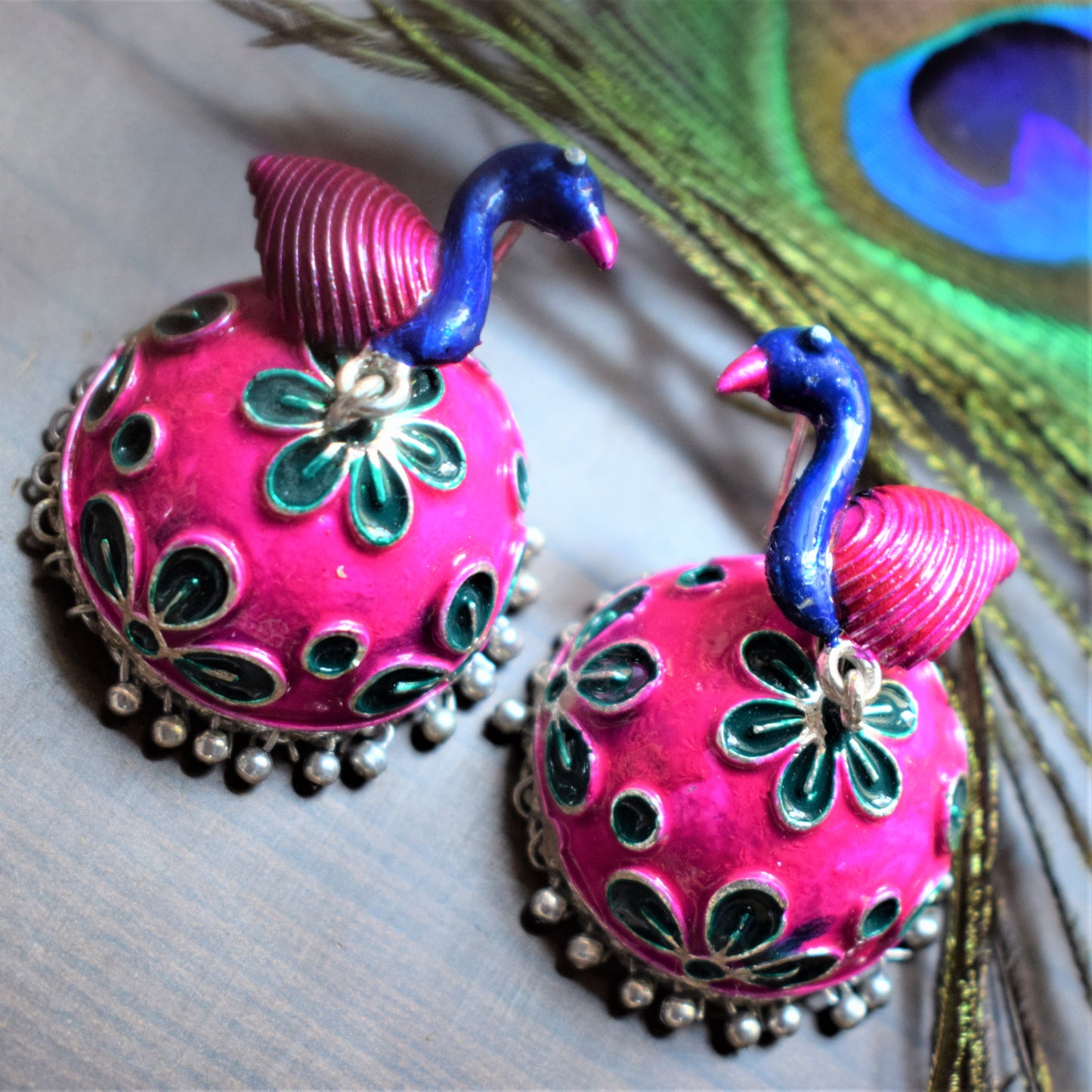 Pink and Blue Meenakari Peacock Carved German Silver Jhumki - GlitterGleam