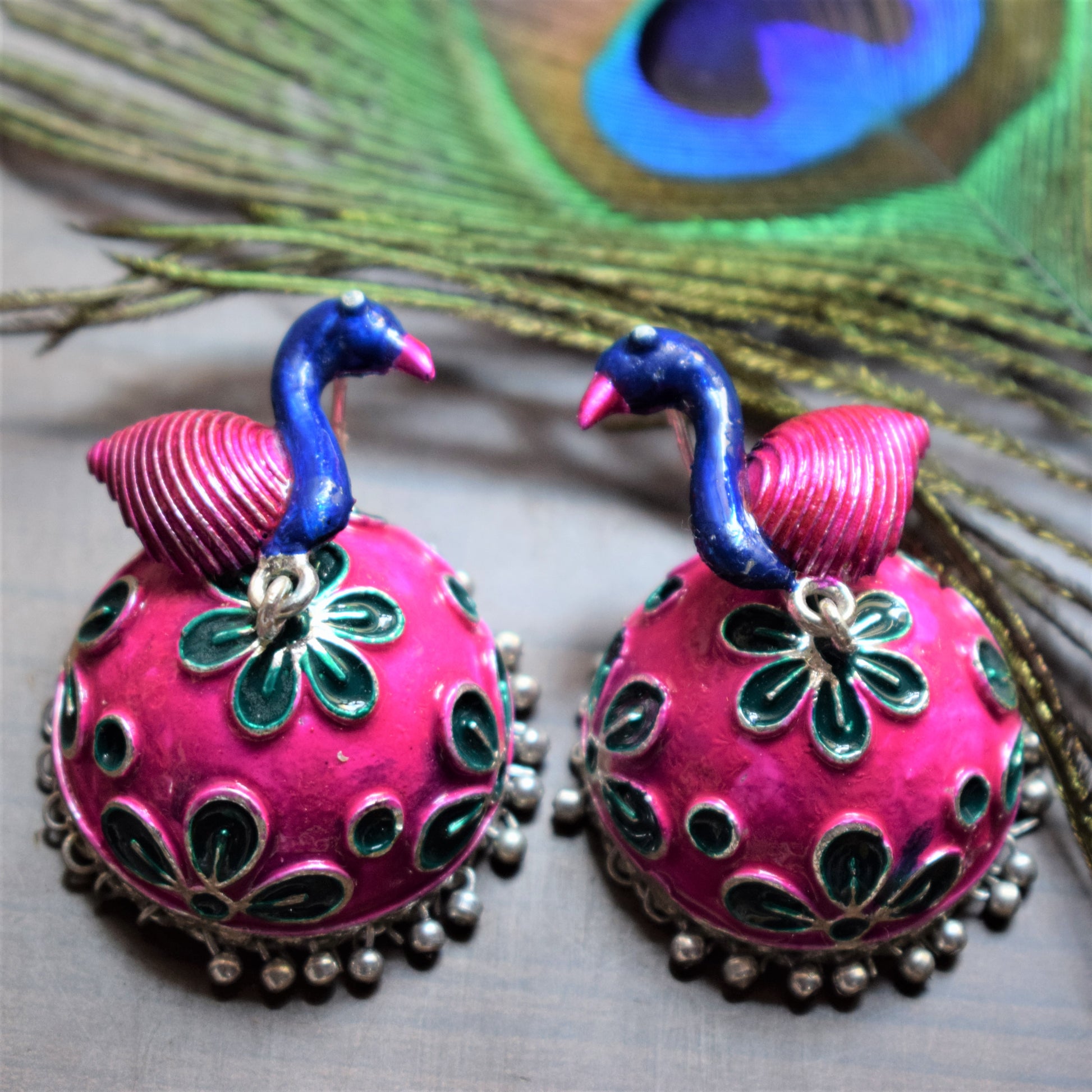 Pink and Blue Meenakari Peacock Carved German Silver Jhumki - GlitterGleam