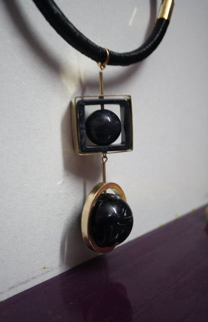 Rotating sphere leather string necklace - GlitterGleam